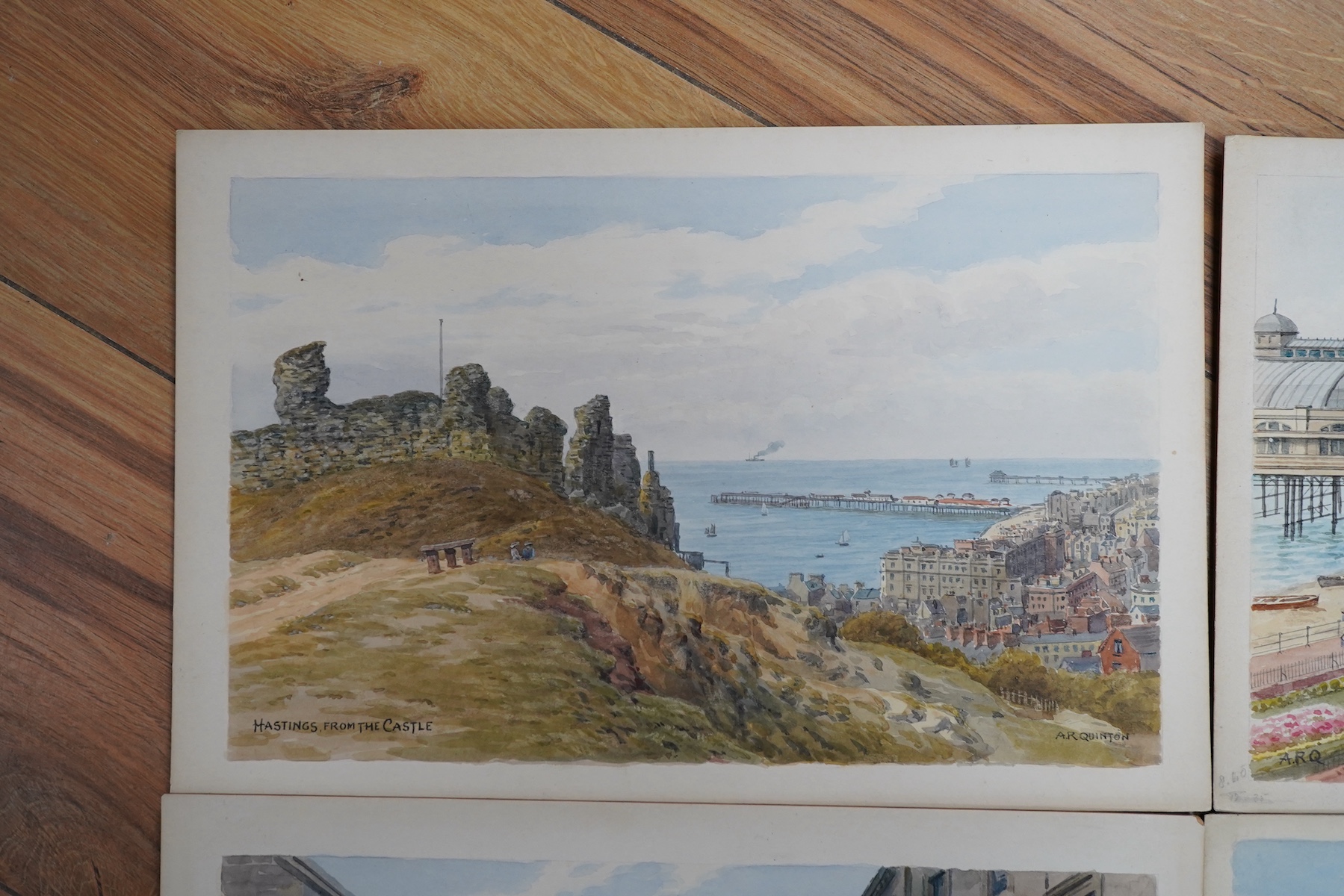 Alfred Robert Quinton (1853-1934), set of four original watercolours for postcard designs, Sussex coastal views comprising: Royal Parade bandstand, Eastbourne, Grand Parade, Eastbourne, Hastings from the castle and Rober